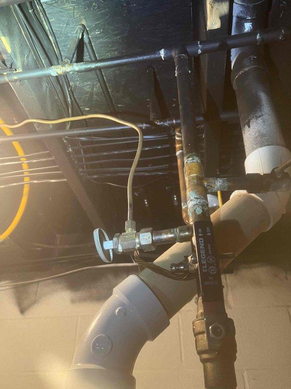 Returned to complete the previously sold hose bib replacement. Replaced corroded copper piping and installed new brass valve with blue handle, connecting to the existing PVC drainage system. Successfully addressed the visible oxidation issues at connection points, ensuring proper function and preventing future leaks.