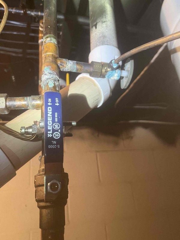 Returned to complete the previously sold hose bib replacement. Replaced corroded copper piping and installed new brass valve with blue handle, connecting to the existing PVC drainage system. Successfully addressed the visible oxidation issues at connection points, ensuring proper function and preventing future leaks.