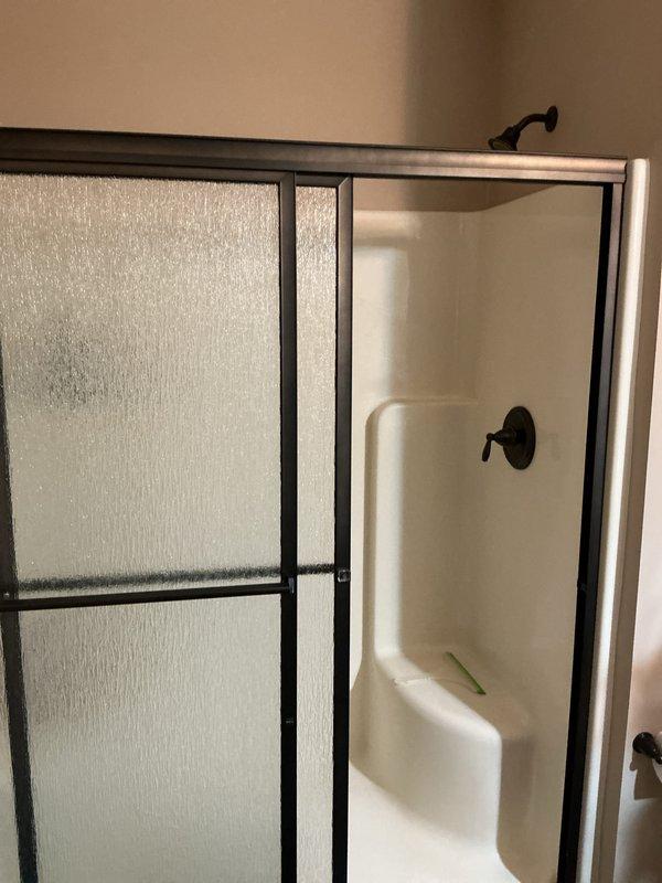 Performed scheduled maintenance inspection on residential tankless water heater per Club membership agreement. Inspected bathroom fixtures including toilet and shower enclosure with sliding glass door; all components found in good working condition with no visible issues. Advised customer that current Club agreement has expired and renewal is recommended for future service visits.