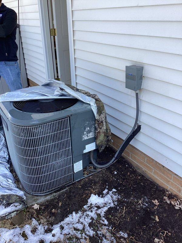 Performed inspection of aging Goodman AC and Arman furnace system for homeowner preparing to sell property. Exterior assessment revealed standard residential AC unit with electrical connections in place, while interior inspection confirmed existing air register placement and ductwork configuration. Recommended complete system replacement to enhance property value and ensure reliable operation for future homeowners.