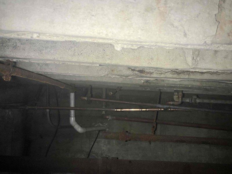 Returned to site to remount a previously sold wall-mounted sink. Discovered significant rust and deterioration on the original mounting bracket, along with water damage to the surrounding wall area. Removed corroded hardware, installed new mounting bracket, and securely reattached sink to ensure proper support and stability.