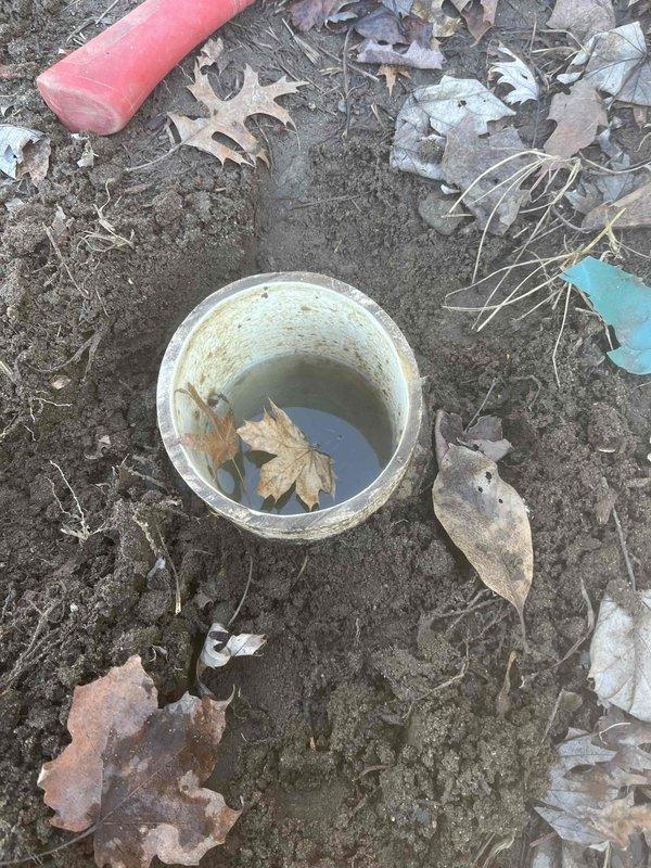 Responded to service call for clogged toilet. Excavated exterior clean-out access point to clear blockage. Successfully restored proper drainage function with standard auger service.