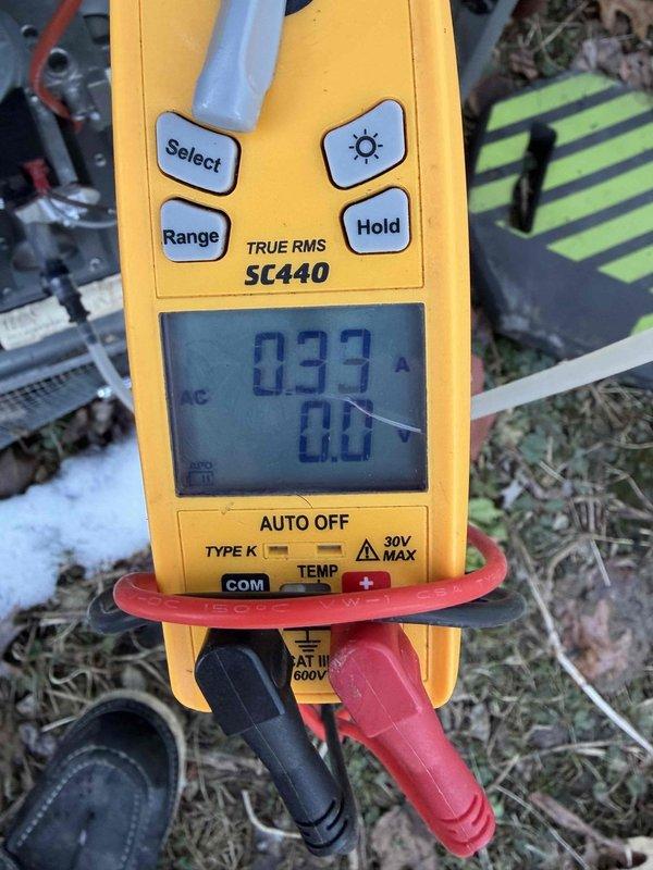 Responded to no-heat call for a 2022 furnace. Diagnosed ignition failure causing loud boom sound. Performed amperage testing with clamp meter showing 0.33A, indicating proper current draw after repair. System restored to normal operation and verified proper function of both furnace and outdoor Trane unit.