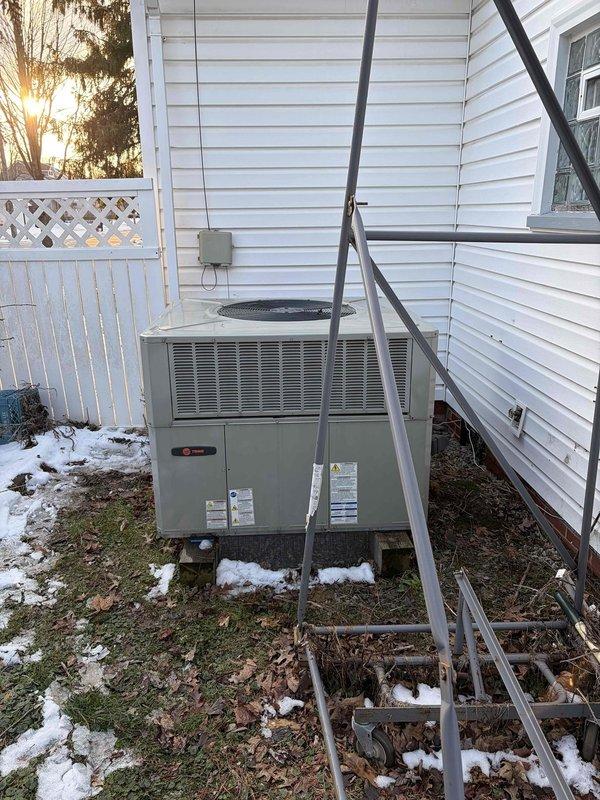 Responded to no-heat call for a 2022 furnace. Diagnosed ignition failure causing loud boom sound. Performed amperage testing with clamp meter showing 0.33A, indicating proper current draw after repair. System restored to normal operation and verified proper function of both furnace and outdoor Trane unit.