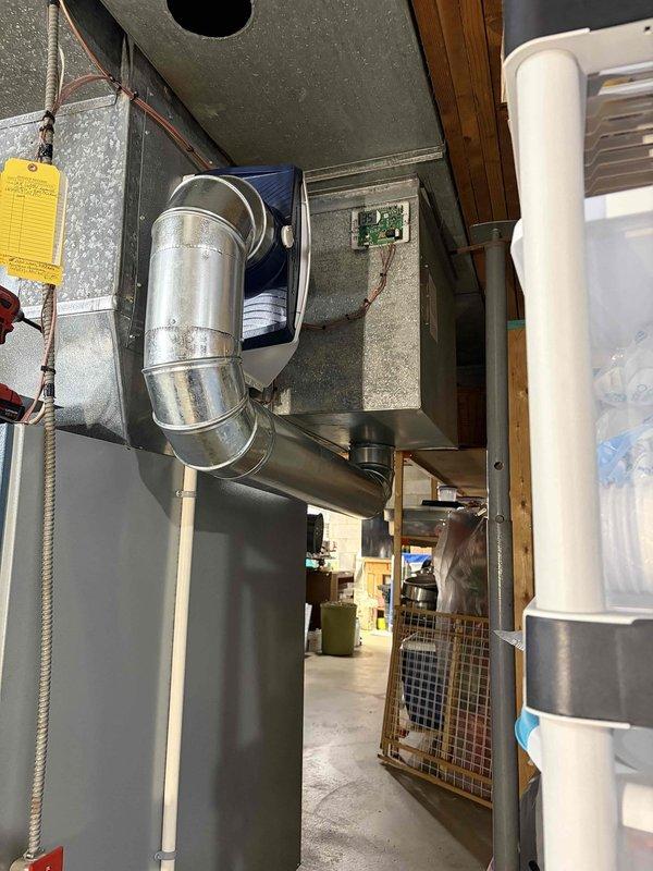 Responded to warranty call for humidifier move control issue. Accessed and inspected HVAC system in basement utility area, focusing on the connection between furnace unit and ductwork. Successfully restored proper functionality to humidifier control system as per warranty requirements.