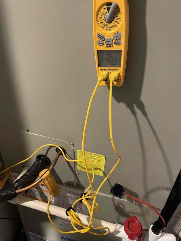 Responded to callback for system not reaching set temperature of 65°F. Diagnostic testing with Fieldpiece SC680 revealed refrigerant pressures and temperatures within normal range (98.7/74.5), but thermostat was operating in auxiliary heat mode. Verified system function and confirmed proper operation of heating elements.