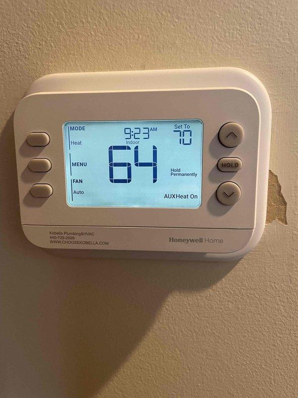 Responded to callback for system not reaching set temperature of 65°F. Diagnostic testing with Fieldpiece SC680 revealed refrigerant pressures and temperatures within normal range (98.7/74.5), but thermostat was operating in auxiliary heat mode. Verified system function and confirmed proper operation of heating elements.