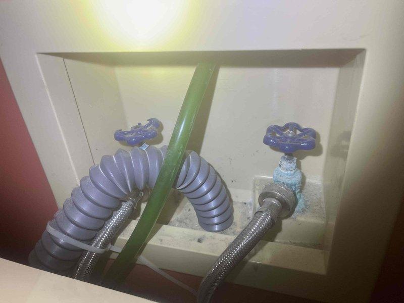 Installed new water shut-off valves and pressure reducing valve (PRV) for washing machine supply lines in recessed wall box. Verified proper operation of valves and checked for leaks after installation. System now functioning correctly with appropriate water pressure for appliance operation.