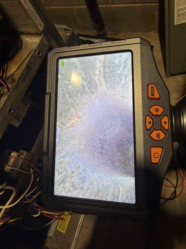 Responded to no-heat call for RGRK-07EMAES furnace system showing three flashing indicator lights and non-functioning blower. Diagnostic inspection with thermal imaging equipment revealed system temperature at 55.7°F. Resolved issue by resetting control board and clearing fault code, restoring normal operation with proper blower function.