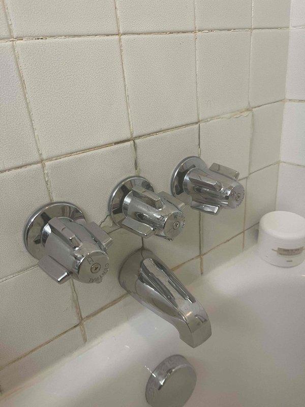 Performed warranty replacement of previously sold water heater. Inspected existing bathroom fixtures including chrome bathtub faucet assembly and connected plumbing components. Completed installation with proper connection of drainage tubing and verified system operation before departure.