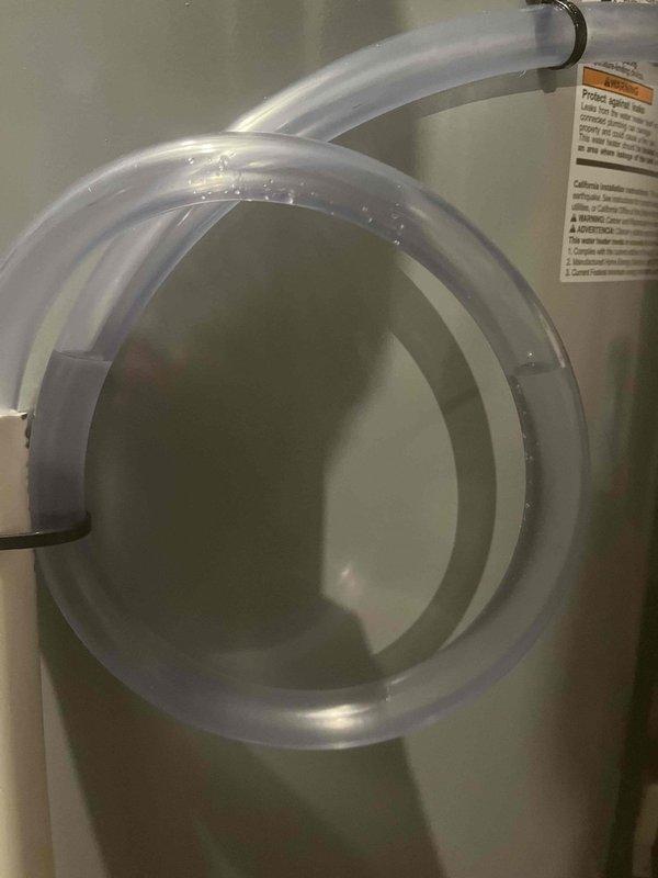 Performed warranty replacement of previously sold water heater. Inspected existing bathroom fixtures including chrome bathtub faucet assembly and connected plumbing components. Completed installation with proper connection of drainage tubing and verified system operation before departure.