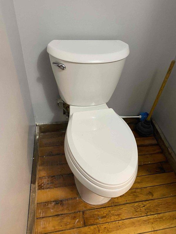 Returned to complete installation job originally sold by sales representative. Installed copper piping along wooden wall structure with appropriate T-joints and shut-off valves, connecting to existing HVAC equipment. Also installed toilet in bathroom corner, properly secured and functional.