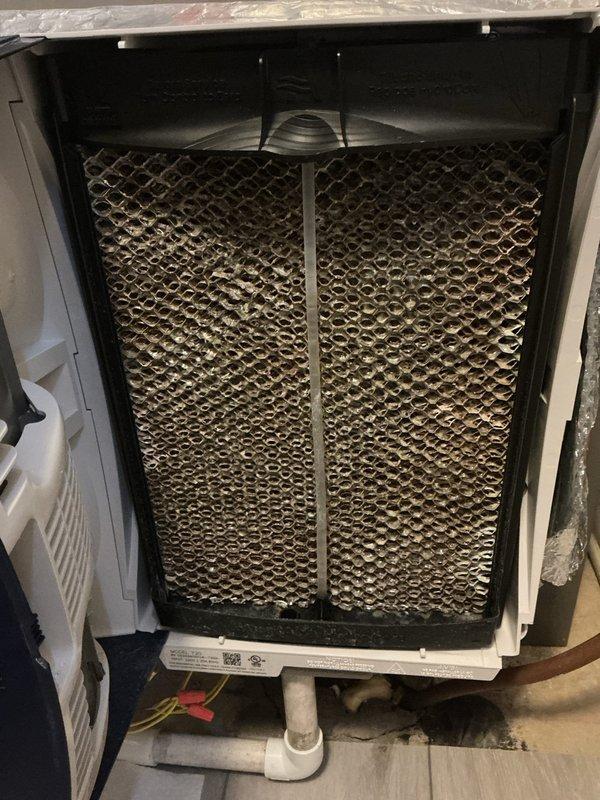Completed follow-up service call to replace the hydro water panel in customer's humidifier system. Removed old humidifier panel which showed significant mineral deposits and discoloration throughout the honeycomb structure. Installed new water panel to restore proper humidification function and ensure optimal system performance.