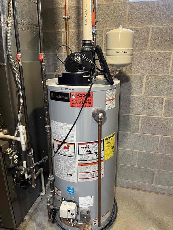 Diagnosed Lochinvar tanked water heater with 4-flash error code and continuous fan operation. Inspection revealed pilot light was functioning but main burner failed to ignite. Performed thermocouple cleaning and testing, confirmed proper gas supply, and reset the system which successfully restored normal heating operation.