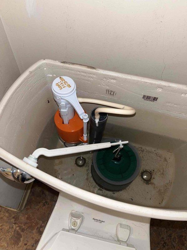 Diagnosed and repaired running toilet on first floor by replacing worn flush valve assembly and adjusting fill valve mechanism. Inspected water supply line connection and noted water damage on adjacent wall, recommending monitoring for potential leaks.