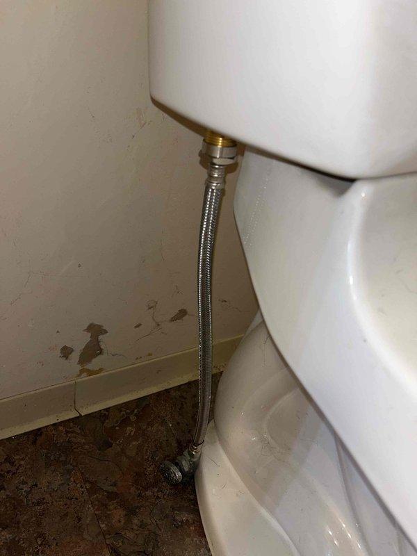 Diagnosed and repaired running toilet on first floor by replacing worn flush valve assembly and adjusting fill valve mechanism. Inspected water supply line connection and noted water damage on adjacent wall, recommending monitoring for potential leaks.