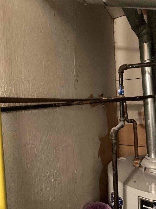 Conducted an on-site evaluation for AprilAire DZ installation, taking measurements of the existing HVAC system components and examining the current plumbing configuration. Documented aging copper pipes showing signs of corrosion and assessed available space for new IAQ equipment integration with the existing water heater and ductwork system.