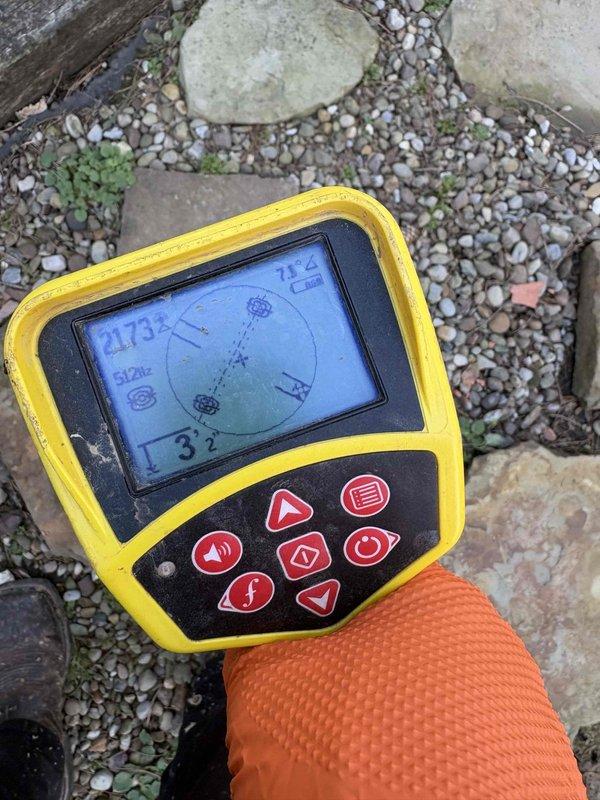 Cleared main drain backup in basement clean-out using electronic locator equipment to identify blockage location. Removed severely corroded metal spring coil that was causing the obstruction, which had accumulated organic debris and was preventing proper drainage.