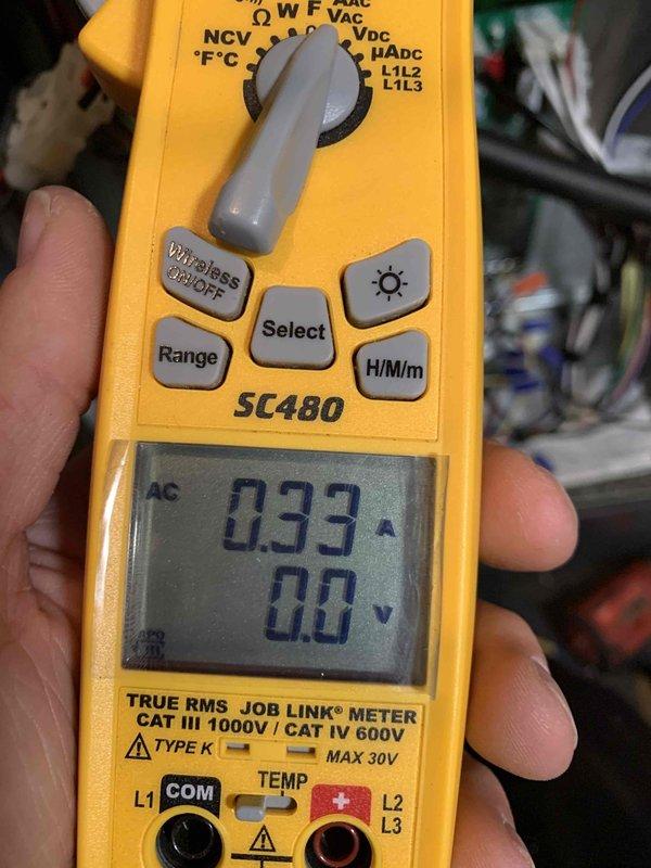 Performed heating maintenance on member's air handler system. Checked AprilAire control unit displaying "35" and verified proper operation of system components. Used SC480 digital multimeter to test electrical readings, confirming normal amperage draw of 0.33A across HVAC components.
