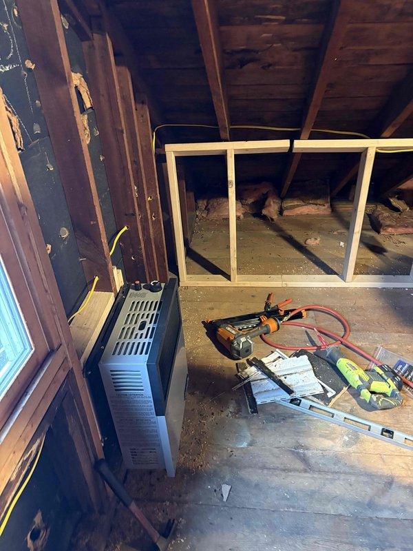 Performed site assessment for gas line installation in an unfinished interior space with exposed framing and joists. Evaluated existing wall-mounted heating unit connections and documented current infrastructure including HVAC components. Provided quote for complete gas piping service to properly supply the heating system while ensuring code compliance during ongoing construction/renovation.
