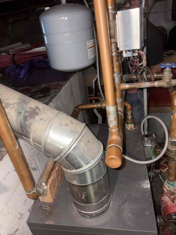 Successfully completed lead swap on boiler system per previous service recommendation. Inspected expansion tank and copper piping connections, confirming proper installation and operation. System is now functioning as designed with proper lead sequencing.