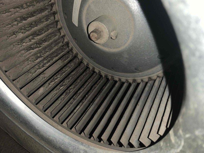 Performed diagnostic service on 20+ year old gas furnace exhibiting rattling and banging noises. Inspection revealed severely dust-clogged blower wheel requiring thorough cleaning, as well as significant corrosion and rust development at ductwork connection points. Documented conditions with photos for customer records.