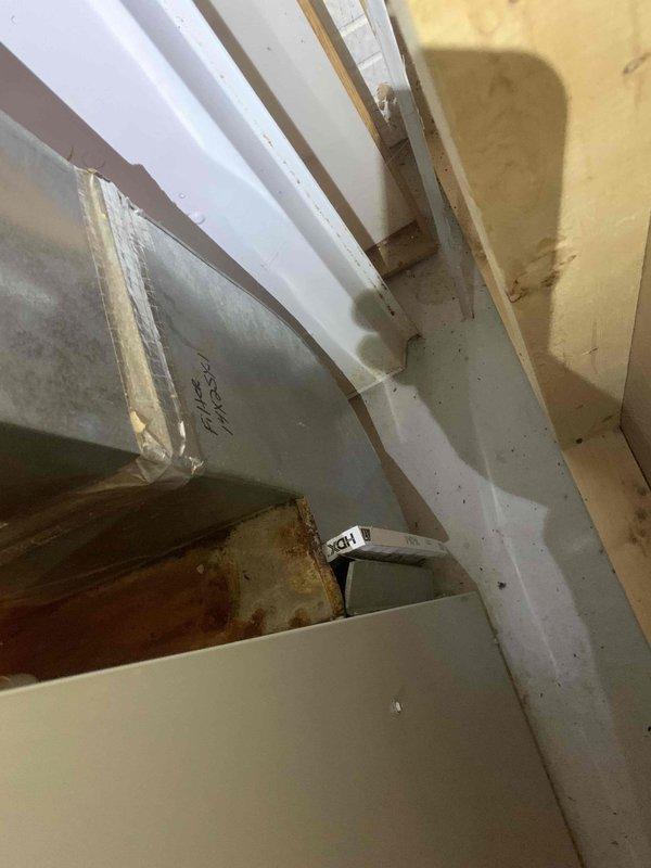 Performed diagnostic service on 20+ year old gas furnace exhibiting rattling and banging noises. Inspection revealed severely dust-clogged blower wheel requiring thorough cleaning, as well as significant corrosion and rust development at ductwork connection points. Documented conditions with photos for customer records.