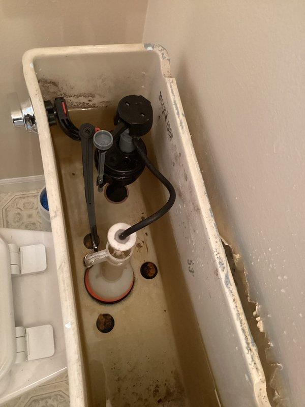 Completed service on two-basin black kitchen sink with leaking faucet. Diagnosed issue with main faucet assembly and performed necessary repairs to resolve the leak. Additional inspection revealed mineral buildup in drain strainer which was cleaned to ensure proper drainage.