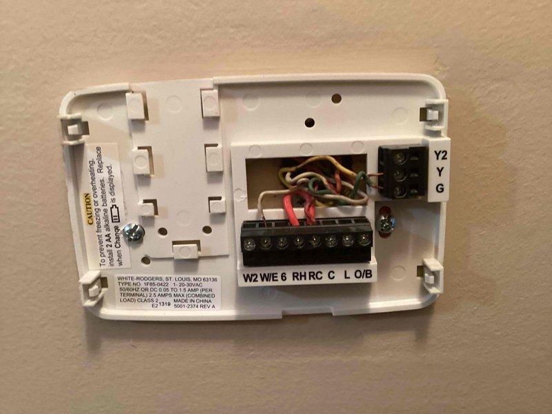 Conducted assessment for furnace replacement quote on 22-year-old existing unit. Customer has operational 10-year-old AC system that will be retained. Inspected thermostat wiring configuration and basement mechanical area to evaluate installation requirements and existing infrastructure compatibility.