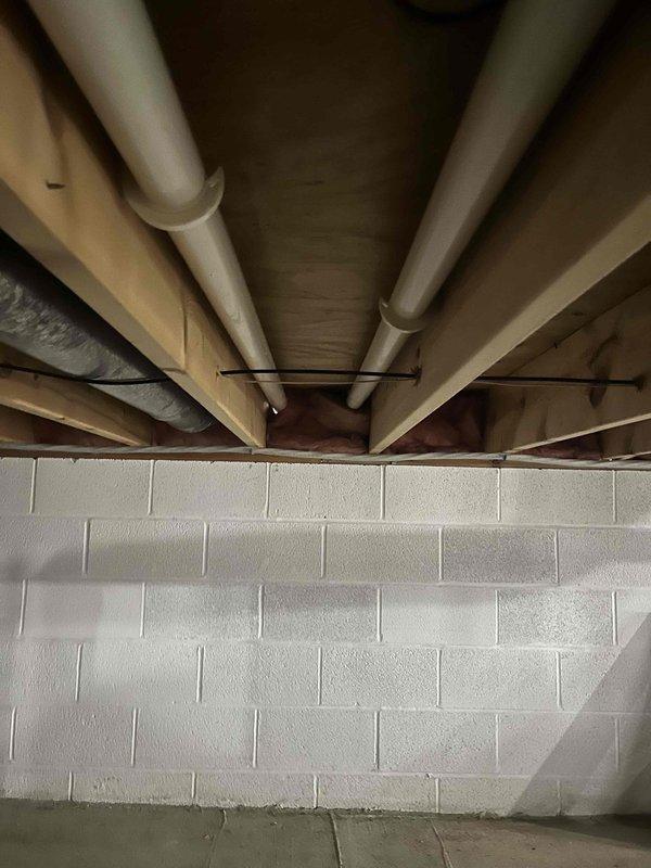 Conducted assessment for furnace replacement quote on 22-year-old existing unit. Customer has operational 10-year-old AC system that will be retained. Inspected thermostat wiring configuration and basement mechanical area to evaluate installation requirements and existing infrastructure compatibility.