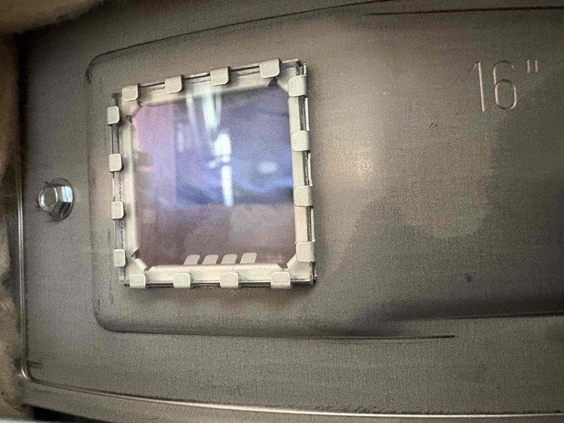 Responded to service call for Lochinvar water heater with active tank leak. Inspection confirmed slow drip from bottom of tank indicating tank failure. Documented condition with photos showing complete installation including expansion tank, copper piping, and venting configuration for replacement recommendation.