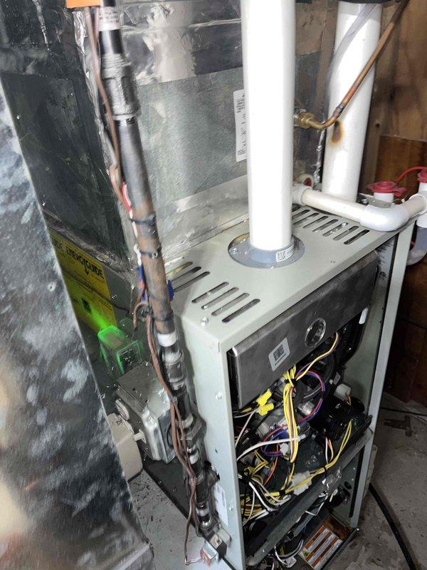 Performed diagnostic inspection on furnace with reported water leak. Discovered condensate drain tube was damaged and removed it for replacement. Recommended regular maintenance service to prevent future issues and ensure proper system operation.