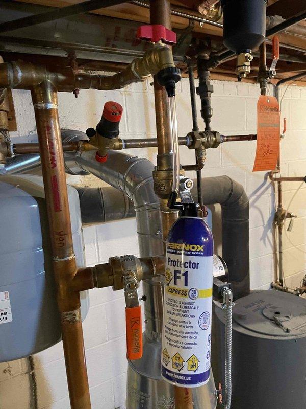 Successfully installed Fernox Protector F1 Express magnetic filter system on customer's boiler to improve system efficiency and prevent future corrosion issues. System was thoroughly inspected and all connections were verified leak-free after installation, with appropriate pressure testing completed to ensure optimal operation.