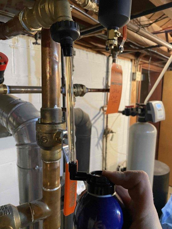 Successfully installed Fernox Protector F1 Express magnetic filter system on customer's boiler to improve system efficiency and prevent future corrosion issues. System was thoroughly inspected and all connections were verified leak-free after installation, with appropriate pressure testing completed to ensure optimal operation.