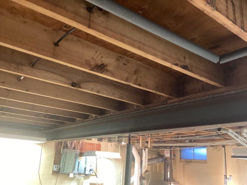Performed lead rotation service on aged boiler system (approximately 30-40 years old). Switched lead function from Bruno unit to maintain proper operational sequence. System located in basement with exposed ceiling structure and concrete floor.