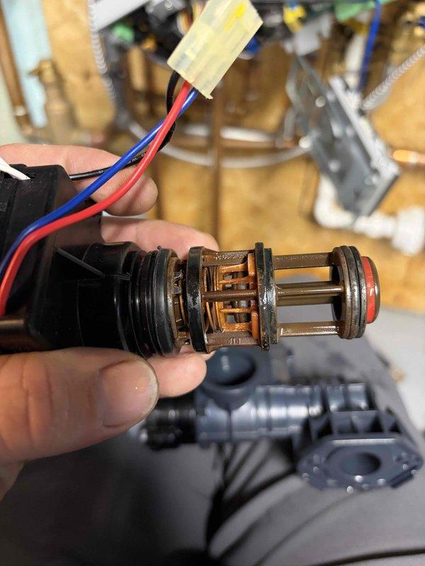 Returned to replace 3-way valve under parts warranty. Successfully removed defective valve assembly with solenoid connection (red/blue/black wires) and installed new component. Performed system testing to verify proper operation of replacement valve. Total labor: 2 hours.