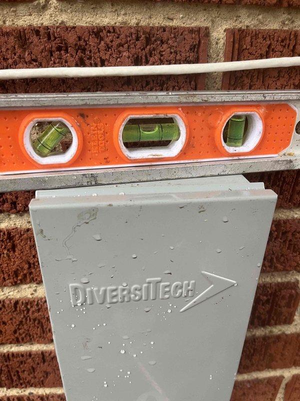 Completed system installation as a follow-up service, including proper leveling of the outdoor condenser unit against brick exterior. Removed existing humidifier as requested. Performed core drilling through brick wall to accommodate new venting requirements. Verified all components were level and properly secured for optimal system performance.