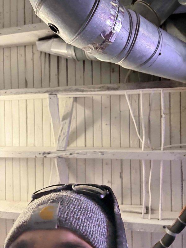 Conducted heating maintenance for club member. Performed gas pressure testing using dual port manometer, confirming readings of 3.65 and 3.72 inWG at test ports. Inspected ductwork system throughout ceiling area, verifying proper installation and integrity of all connections.