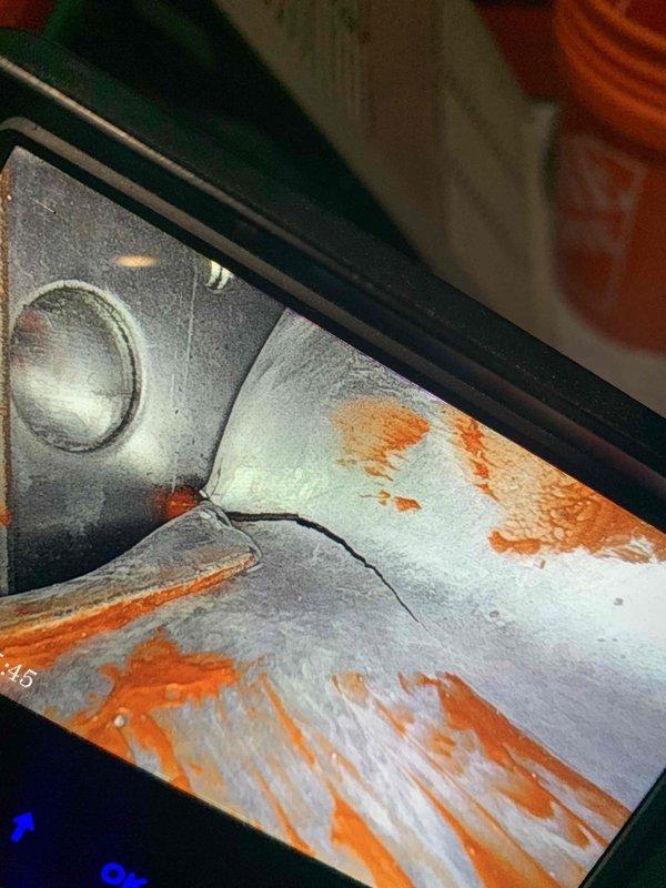 Performed scheduled furnace tune-up, discovering significant rust and corrosion in the heat exchanger along with a visible crack that requires immediate attention. Visual inspection of the blower wheel assembly revealed normal operation with no buildup or damage. Discussed options for tankless water heater maintenance to be scheduled separately.