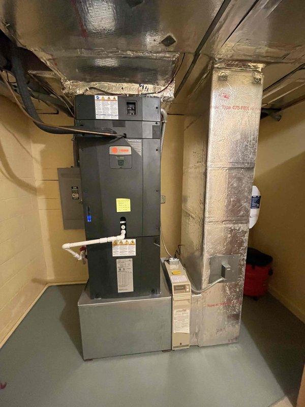 Performed comprehensive tune-up on 2-year-old 5-ton Trane HVAC system after customer reported high energy bills and heating issues with auxiliary heat not turning off. Inspected and verified capacitor (TOTALINE P291-4074RS 40+7.5MFD) was functioning within specifications and cleaned minor dust accumulation from internal components to improve system efficiency.