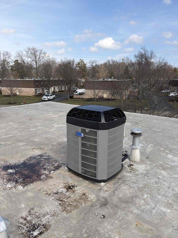 Inspected and serviced rooftop A/C unit; identified need for weatherguard top installation. Will return with extension ladder to complete weatherguard top installation (estimated 10-minute procedure).