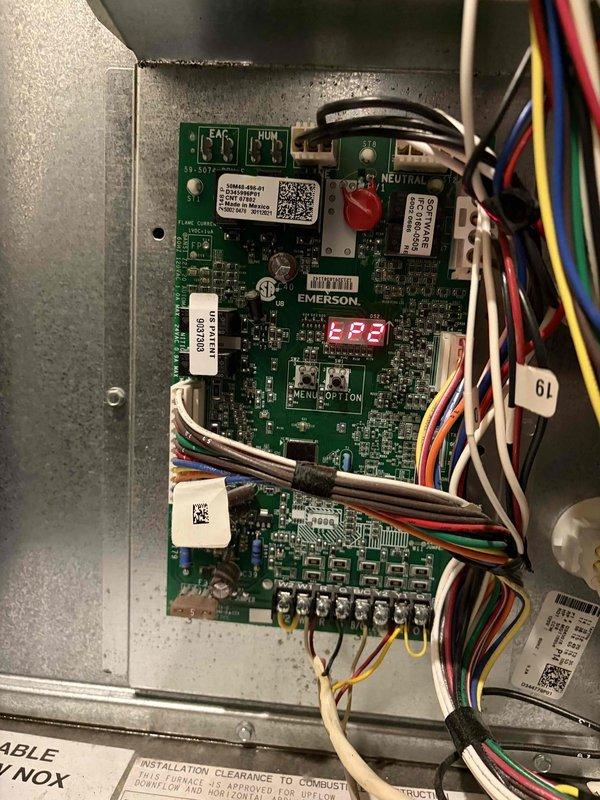 Performed heating maintenance on air handler unit as part of membership service. Inspected Emerson control board which displayed "82" on digital readout; all connections and terminals appeared secure with proper wire routing. Replaced igniter/flame sensor assembly as preventative measure to ensure reliable system operation during heating season.