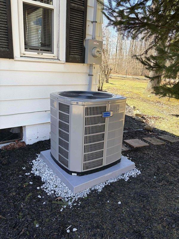 Performed heating start-up service and identified damaged insulation on black pipe (ID #1063782) with visible moisture at connection point. Inspected outdoor American Standard condenser unit which appears well-maintained with proper installation on concrete pad with stone drainage perimeter.
