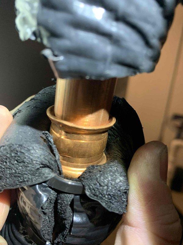 Performed cooling maintenance on air handler unit per club membership agreement. Identified damaged insulation on refrigerant lines with visible tears and deterioration. Inspected copper piping and brass fittings, noting good condition of these components despite the compromised insulation.
