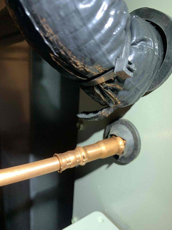 Performed cooling maintenance on air handler unit per club membership agreement. Identified damaged insulation on refrigerant lines with visible tears and deterioration. Inspected copper piping and brass fittings, noting good condition of these components despite the compromised insulation.