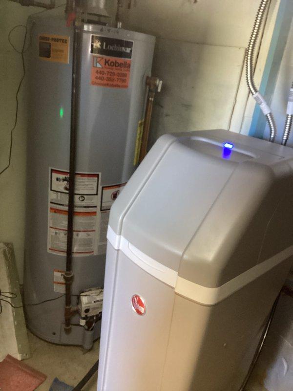 Responded to service call for drainage issues affecting washing machine discharge into utility tub and kitchen sink backup. Inspected plumbing system including P-trap configuration, drain assembly, and water supply lines. Successfully cleared blockage in main drain line that was causing multiple fixture backup, restoring proper drainage function to both the utility tub and kitchen sink.