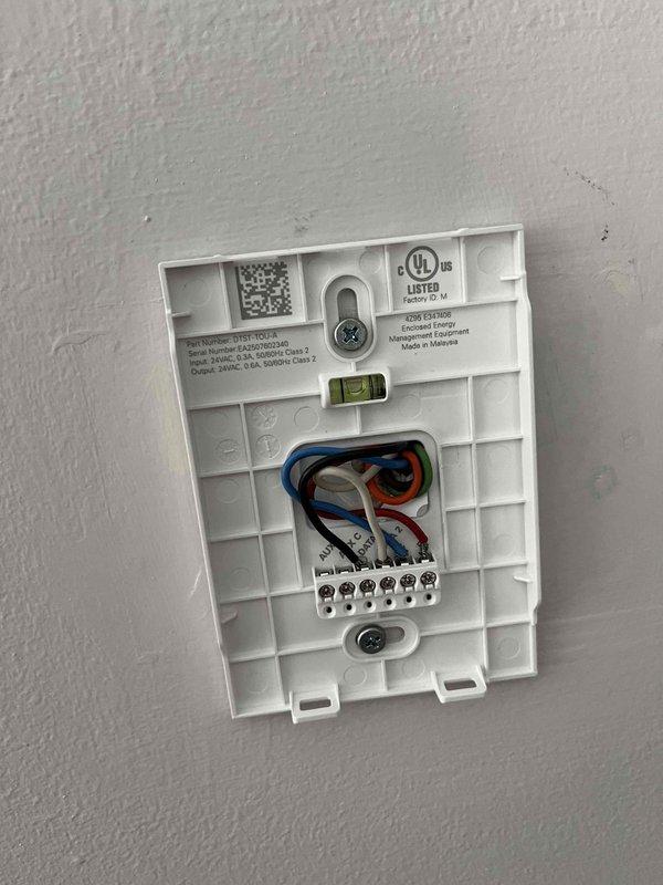 Performed scheduled cooling maintenance on air handler unit per membership agreement. Inspected and verified proper operation of thermostat wiring connections and terminal block integrity. Confirmed thermostat calibration showing 74°F with all system functions operating correctly.