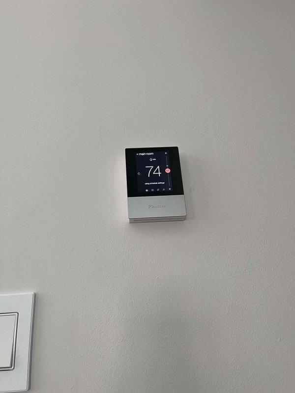 Performed scheduled cooling maintenance on air handler unit per membership agreement. Inspected and verified proper operation of thermostat wiring connections and terminal block integrity. Confirmed thermostat calibration showing 74°F with all system functions operating correctly.
