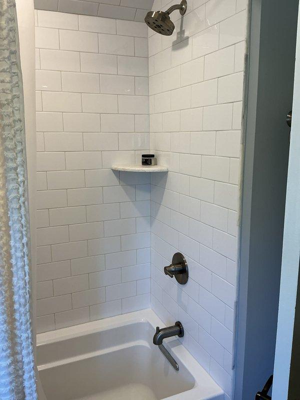 Performed membership service visit to assess poor water flow issue at basement bathroom sink. Inspected faucet connections and determined need for replacement of supply lines due to flow restriction. Recommended replacement of existing brushed nickel faucet assembly to resolve persistent low water pressure problem.