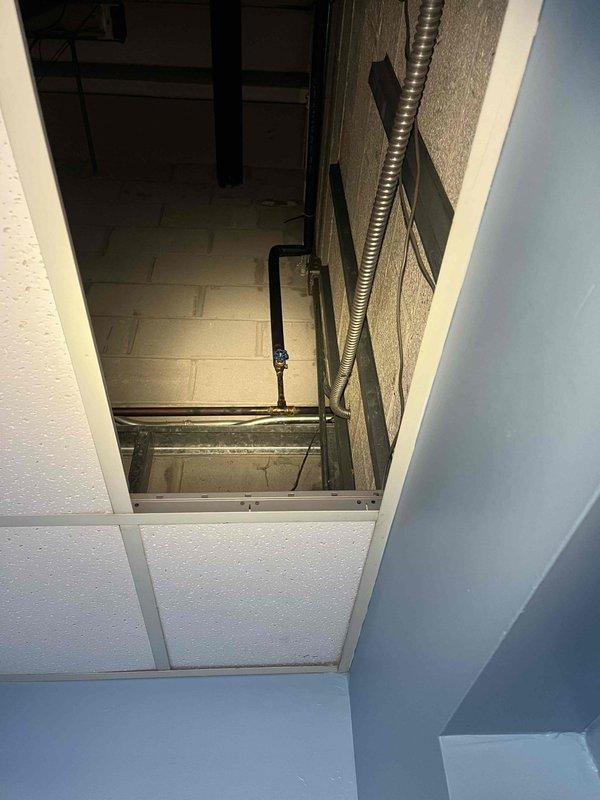 Located and repaired a broken pipe within the wall that was causing water to leak across the lobby floor. Accessed the plumbing system through ceiling panels to identify the source of the leak and completed necessary repairs to restore proper function.